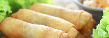 Crisp spring rolls served with fresh herbs — the Sala Thai menu page
